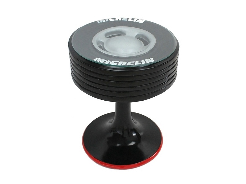JBFP034_MICHELIN_TIRE_COFFEE_TABLE_ON_STAND_WITH_A_GLASS_TOP.JPG
