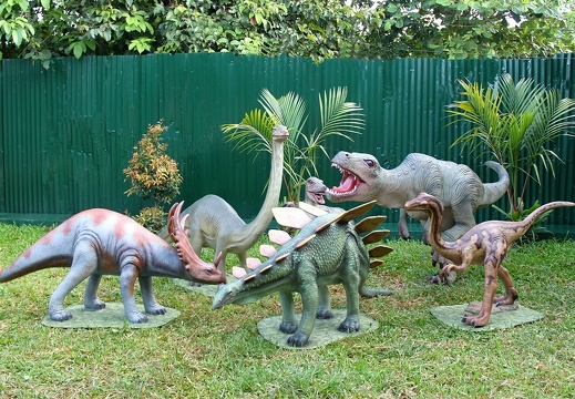 158 LIFE SIZE VELOCIRAPTOR ATTACKING A GROUP OF BABY DINOSAURS